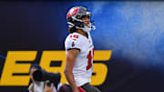 Dec 15, 2024; Inglewood, California, USA; Tampa Bay Buccaneers wide receiver Jalen McMillan (15) scores a touchdown against the Los Angeles Chargers during the first half at SoFi Stadium. Mandatory Credit: Gary A. Vasquez-Imagn Images
