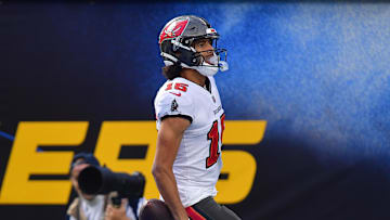 Dec 15, 2024; Inglewood, California, USA; Tampa Bay Buccaneers wide receiver Jalen McMillan (15) scores a touchdown against the Los Angeles Chargers during the first half at SoFi Stadium. Mandatory Credit: Gary A. Vasquez-Imagn Images