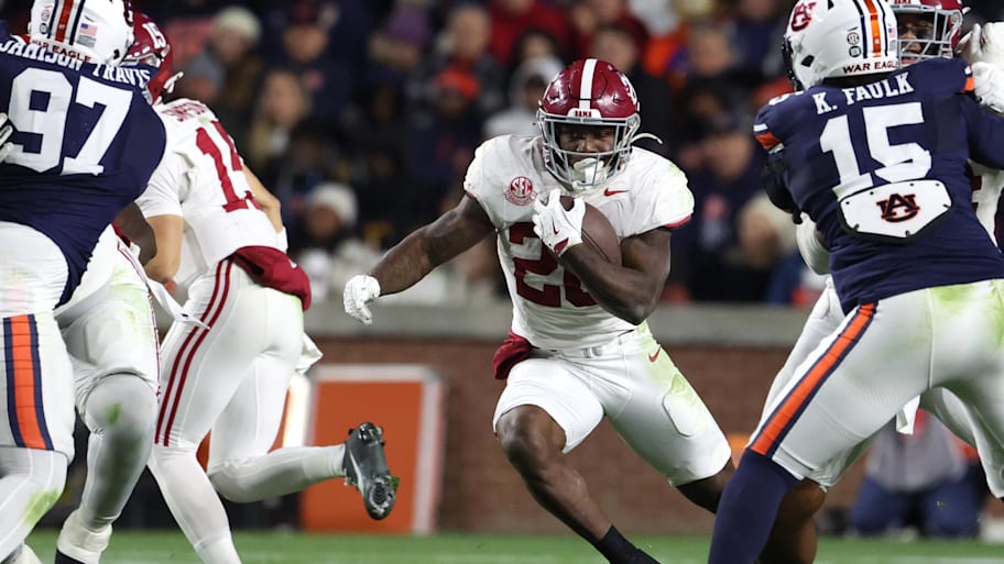 Alabama’s Jamarion Miller runs the ball against Auburn. 