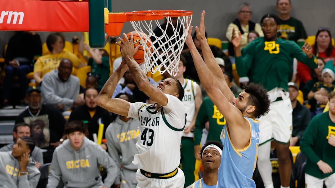 Baylor Bears guard Cameron Carr (43) scores a basket ahead of Southern University Jaguars forward Malek Abdelgowad (8) during the second half at Paul and Alejandra Foster Pavilion