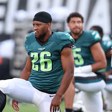 Aug 1, 2024; Philadelphia, PA, USA; Philadelphia Eagles running back Saquon Barkley (26) stretches during practice at Lincoln Financial Field. Mandatory Credit: Bill Streicher-Imagn Images