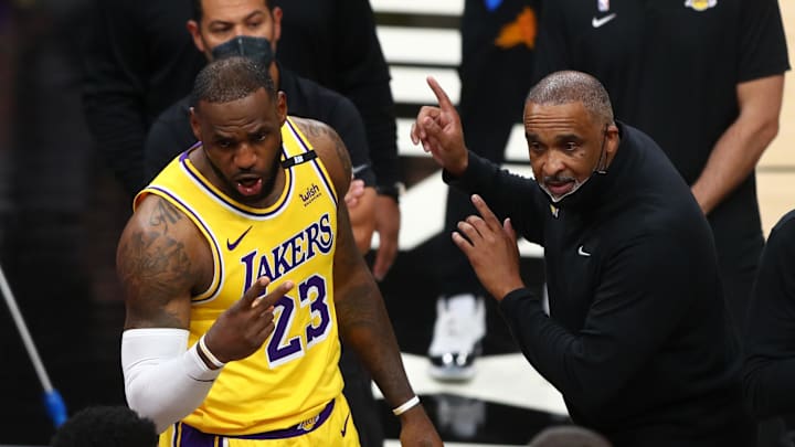 Los Angeles Lakers forward LeBron James (23) and assistant coach Phil Handy against the Phoenix Suns. 