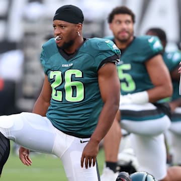 Aug 1, 2024; Philadelphia, PA, USA; Philadelphia Eagles running back Saquon Barkley (26) stretches during practice at Lincoln Financial Field. 