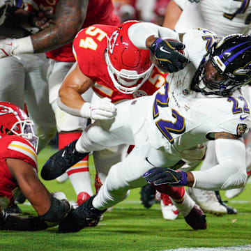 Sep 5, 2024; Kansas City, Missouri, USA; Baltimore Ravens running back Derrick Henry (22) scores a touchdown as Kansas City Chiefs linebacker Leo Chenal (54) attempts the tackle during the first half at GEHA Field at Arrowhead Stadium. Mandatory Credit: Denny Medley-Imagn Images