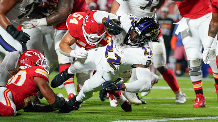 Sep 5, 2024; Kansas City, Missouri, USA; Baltimore Ravens running back Derrick Henry (22) scores a touchdown as Kansas City Chiefs linebacker Leo Chenal (54) attempts the tackle during the first half at GEHA Field at Arrowhead Stadium. Mandatory Credit: Denny Medley-Imagn Images