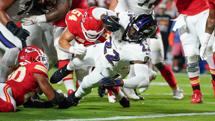 Sep 5, 2024; Kansas City, Missouri, USA; Baltimore Ravens running back Derrick Henry (22) scores a touchdown as Kansas City Chiefs linebacker Leo Chenal (54) attempts the tackle during the first half at GEHA Field at Arrowhead Stadium. Mandatory Credit: Denny Medley-Imagn Images