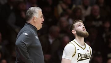 Purdue Boilermakers head coach Matt Painter talks to guard Braden Smith (3)