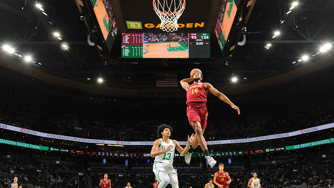 Chaney Johnson dunks against the Boston Celtics