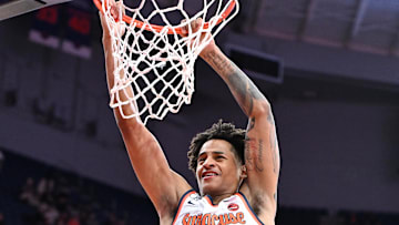 Nov 3, 2025; Syracuse, New York, USA; Syracuse Orange forward Kiyan Anthony (7) dunks the ball against the Binghamton Bearcats in the second half at the JMA Wireless Dome. Mandatory Credit: Mark Konezny-Imagn Images