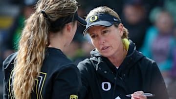 Oregon head coach Melyssa Lombardi talks with pitcher Stevie Hansen as the Oregon Ducks fell to UCLA 7-4 on Saturday, March 25, 2023, at Jane Sanders Stadium in Eugene, Ore.