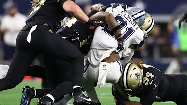 New Orleans Saints defensive end Cameron Jordan (94) is in on a stop of Dallas Cowboys running back Ezekiel Elliott (21) 