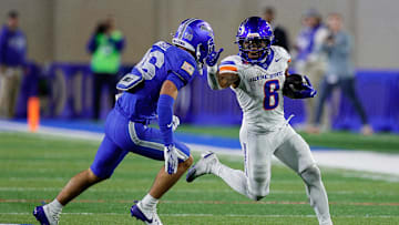 Sep 20, 2025; Colorado Springs, Colorado, USA; Boise State Broncos running back Malik Sherrod (8) runs the ball as Air Force Falcons defensive back Max Mustell (36) defends in the fourth quarter at Falcon Stadium.