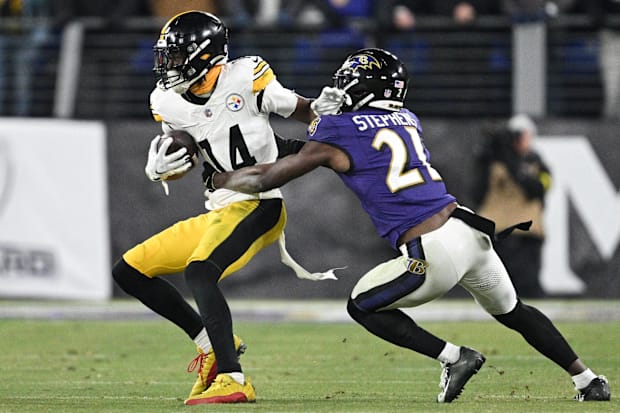 Pittsburgh Steelers WR George Pickens runs against Baltimore Ravens cornerback Brandon Stephens.