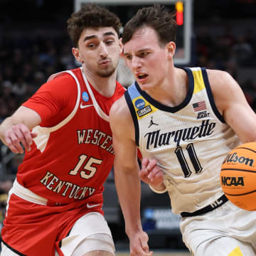 Mar 22, 2024; Indianapolis, IN, USA; Marquette Golden Eagles guard Tyler Kolek (11) controls the ball against Western Kentucky Hilltoppers guard Jack Edelen (15) in the second half in the first round of the 2024 NCAA Tournament at Gainbridge FieldHouse. Mandatory Credit: Trevor Ruszkowski-USA TODAY Sports