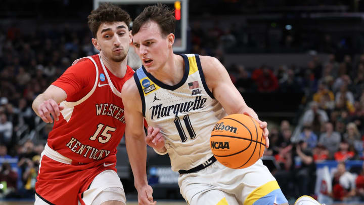 Mar 22, 2024; Indianapolis, IN, USA; Marquette Golden Eagles guard Tyler Kolek (11) controls the ball against Western Kentucky Hilltoppers guard Jack Edelen (15) in the second half in the first round of the 2024 NCAA Tournament at Gainbridge FieldHouse. Mandatory Credit: Trevor Ruszkowski-USA TODAY Sports
