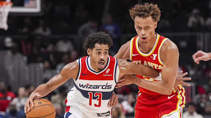 Oct 28, 2024; Atlanta, Georgia, USA; Washington Wizards guard Jordan Poole (13) dribbles against Atlanta Hawks guard Dyson Daniels (5) during the first half at State Farm Arena. Mandatory Credit: Dale Zanine-Imagn Images