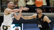 Purdue Boilermakers forward Mason Gillis (0) passes the ball past Michigan State Spartans forward Malik Hall (25) during the NCAA men   s basketball game, Saturday, March 2, 2024, at Mackey Arena in West Lafayette, Ind.