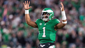 Nov 3, 2024; Philadelphia, Pennsylvania, USA; Philadelphia Eagles quarterback Jalen Hurts (1) reacts to Saquon Barkley (not pictured) touchdown run against the Jacksonville Jaguars during the second quarter at Lincoln Financial Field. Mandatory Credit: Bill Streicher-Imagn Images