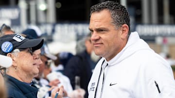 Penn State athletic director Pat Kraft talks with members of an alumni group outside of Beaver Stadium before an NCAA football game against Michigan Saturday, Nov. 11, 2023, in State College, Pa.