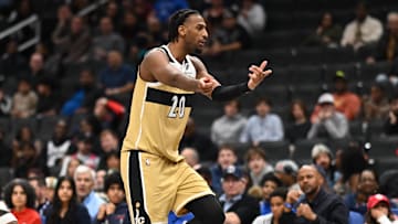 Nov 16, 2025; Washington, District of Columbia, USA;  Washington Wizards center Alex Sarr (20) reacts to a foul call in front of Brooklyn Nets guard Terance Mann (14) during the fourth quarter at Capital One Arena. Mandatory Credit: Rafael Suanes-Imagn Images