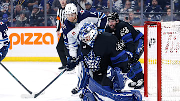 Oct 28, 2024; Winnipeg, Manitoba, CAN; Winnipeg Jets forward Gabriel Vilardi (13) looks for a rebound from Toronto Maple Leafs goalie Anthony Stolarz (41) during the second period at Canada Life Centre. Mandatory Credit: Terrence Lee-Imagn Images