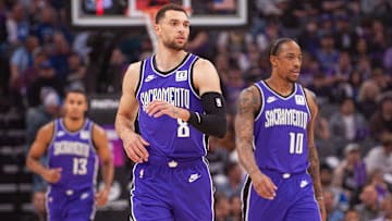 Feb 24, 2025; Sacramento, California, USA; Sacramento Kings guard Zach LaVine (8) and forward DeMar DeRozan (10) and forward Keegan Murray (13) walk up the court during the first quarter against the Charlotte Hornets at Golden 1 Center. Mandatory Credit: Ed Szczepanski-Imagn Images