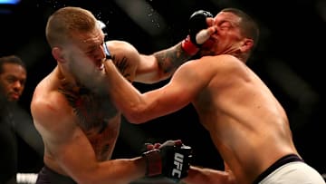 March 5, 2016; Las Vegas, NV, USA; Conor McGregor moves in for a punch against Nate Diaz during UFC 196 at MGM Grand Garden Arena. Mandatory Credit: Mark J. Rebilas-Imagn Images
