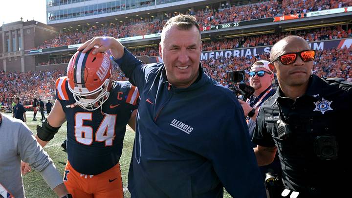 Sep 27, 2025; Champaign, Illinois, USA;  Illinois Fighting Illini head coach Bret Bielema gives players a hand after a 34-32 win against the Southern California Trojans at Memorial Stadium. Mandatory Credit: Ron Johnson-Imagn Images