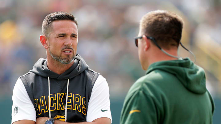 Green Bay Packers Coach Matt LaFleur, left, talks with General Manager Brian Gutekunst during practice on July 25, 2025, at Ray Nitschke Field in Ashwaubenon, Wis.