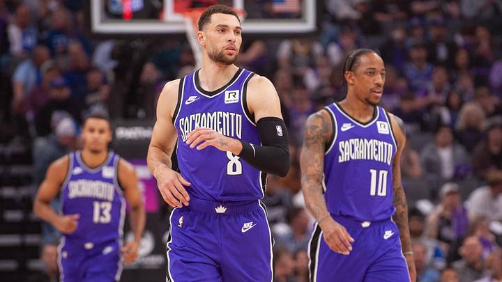 Feb 24, 2025; Sacramento, California, USA; Sacramento Kings guard Zach LaVine (8) and forward DeMar DeRozan (10) and forward Keegan Murray (13) walk up the court during the first quarter against the Charlotte Hornets at Golden 1 Center. Mandatory Credit: Ed Szczepanski-Imagn Images