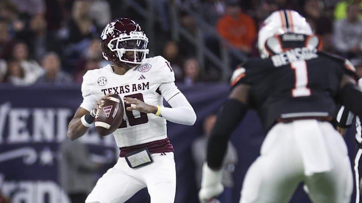 Dec 27, 2023; Houston, TX, USA; Texas A&M Aggies quarterback Marcel Reed (10) looks for an open receiver during the first quarter against the Oklahoma State Cowboys at NRG Stadium. Mandatory Credit: Troy Taormina-Imagn Images