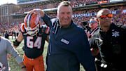Sep 27, 2025; Champaign, Illinois, USA;  Illinois Fighting Illini head coach Bret Bielema gives players a hand after a 34-32 win against the Southern California Trojans at Memorial Stadium. Mandatory Credit: Ron Johnson-Imagn Images