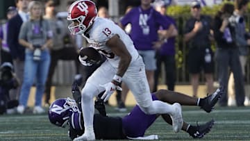 Oct 5, 2024; Evanston, Illinois, USA; Indiana Hoosiers wide receiver Elijah Sarratt (13) runs the ball against Northwestern Wildcats defensive back Braden Turner (9) during the second half at Lanny and Sharon Martin Stadium. Mandatory Credit: David Banks-Imagn Images
