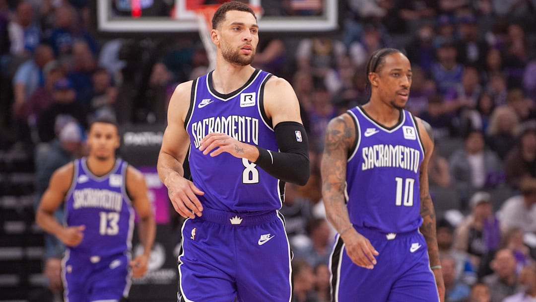 Feb 24, 2025; Sacramento, California, USA; Sacramento Kings guard Zach LaVine (8) and forward DeMar DeRozan (10) and forward Keegan Murray (13) walk up the court during the first quarter against the Charlotte Hornets at Golden 1 Center. Mandatory Credit: Ed Szczepanski-Imagn Images