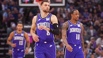 Feb 24, 2025; Sacramento, California, USA; Sacramento Kings guard Zach LaVine (8) and forward DeMar DeRozan (10) and forward Keegan Murray (13) walk up the court during the first quarter against the Charlotte Hornets at Golden 1 Center. Mandatory Credit: Ed Szczepanski-Imagn Images