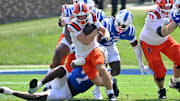Sep 6, 2025; Durham, North Carolina, USA;  Illinois Fighting Illini Aidan Laughery (21) runs against Duke Blue Devils defensive end Vincent Anthony Jr. (7) during the first quarter at Wallace Wade Stadium. Mandatory Credit: Zachary Taft-Imagn Images