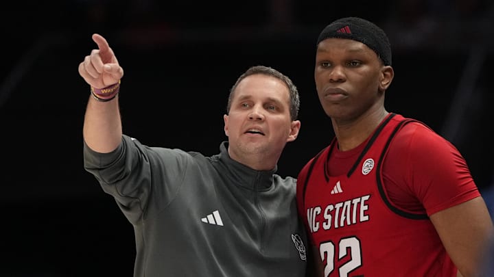 Mar 12, 2026; Charlotte, NC, USA; NC State Wolfpack head coach Will Wade with forward Ven-Allen Lubin (22) in the first half at Spectrum Center. Mandatory Credit: Bob Donnan-Imagn Images