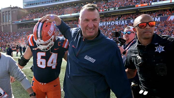 Sep 27, 2025; Champaign, Illinois, USA;  Illinois Fighting Illini head coach Bret Bielema gives players a hand after a 34-32 win against the Southern California Trojans at Memorial Stadium. Mandatory Credit: Ron Johnson-Imagn Images