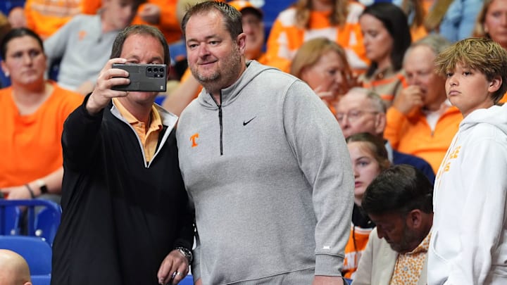 A Tennessee fan takes a photos with Tennessee football coach Josh Heupel at the NCAA Tournament Elite Eight game between Tennessee and Houston at Lucas Oil Stadium in Indianapolis, Ind., on Sunday, March 30, 2025. A Tennessee fan takes a photos with Tennessee football coach Josh Heupel at the NCAA Tournament Elite Eight game between Tennessee and Houston at Lucas Oil Stadium in Indianapolis, Ind., on Sunday, March 30, 2025.