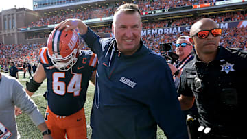 Sep 27, 2025; Champaign, Illinois, USA;  Illinois Fighting Illini head coach Bret Bielema gives players a hand after a 34-32 win against the Southern California Trojans at Memorial Stadium. Mandatory Credit: Ron Johnson-Imagn Images