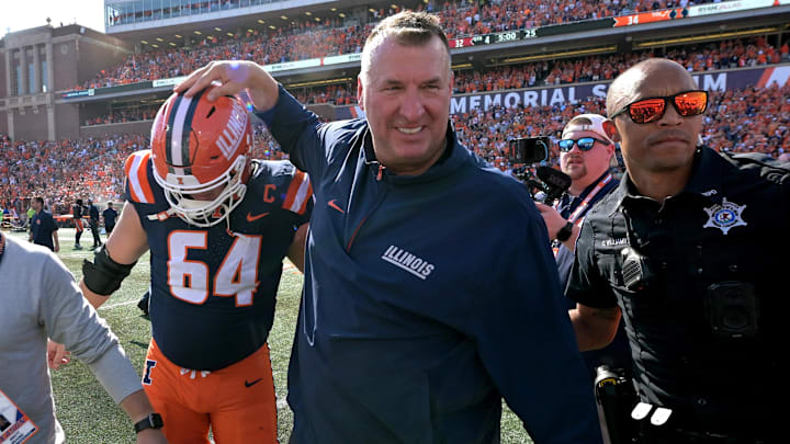 Sep 27, 2025; Champaign, Illinois, USA;  Illinois Fighting Illini head coach Bret Bielema gives players a hand after a 34-32 win against the Southern California Trojans at Memorial Stadium. Mandatory Credit: Ron Johnson-Imagn Images