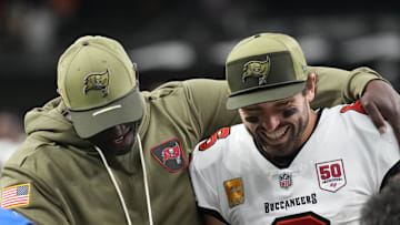 Tampa Bay Buccaneers head coach Todd Bowles and quarterback Baker Mayfield (6) celebrate a win over the New Orleans Saints