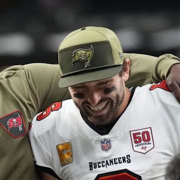 Tampa Bay Buccaneers head coach Todd Bowles and quarterback Baker Mayfield (6) celebrate a win over the New Orleans Saints