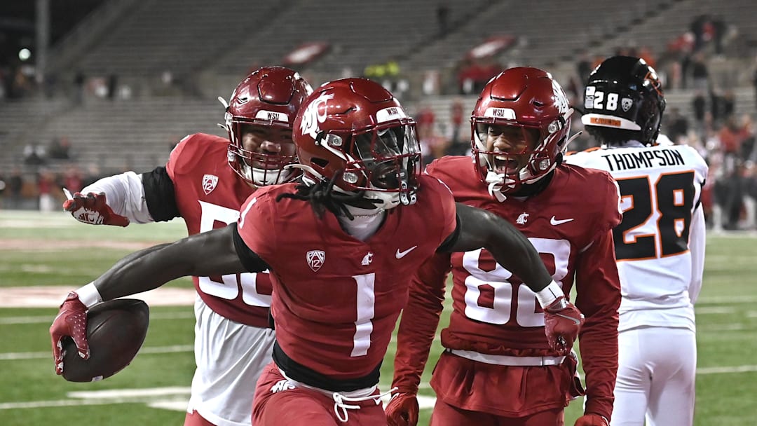 Nov 29, 2025; Pullman, Washington, USA; Washington State Cougars running back Angel Johnson (1) celebrates a a touchdown against the Oregon State Beavers in the second half at Gesa Field at Martin Stadium. Washington State Cougars won 32-8. Mandatory Credit: James Snook-Imagn Images
