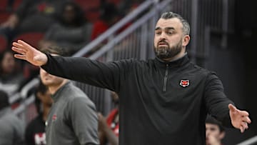 Dec 13, 2023; Louisville, Kentucky, USA; Arkansas State Red Wolves head coach Bryan Hodgson calls out instructions during the second half against the Louisville Cardinals at KFC Yum! Center. Arkansas State defeated Louisville 75-63. Mandatory Credit: Jamie Rhodes-Imagn Images