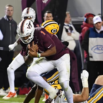 Oct 24, 2025; Blacksburg, Va.; Virginia Tech quarterback Kyron Drones (1) runs the ball for a touchdown against California.