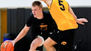 Iowa’s Bennett Stirtz (14) dribbles down court as Peyton McCollum (5) defends during practice June 19, 2025 at Carver-Hawkeye Arena in Iowa City, Iowa.