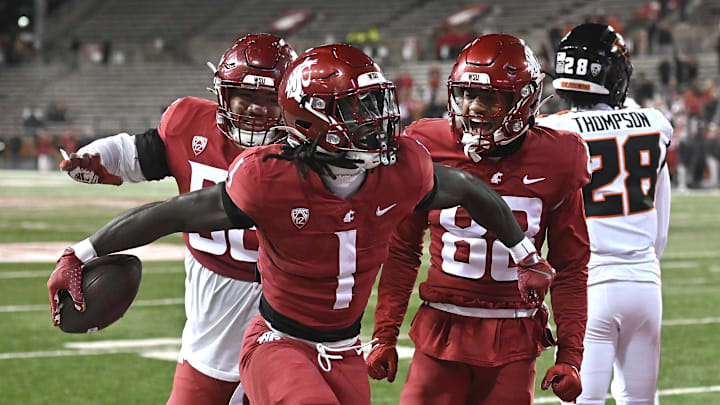 Nov 29, 2025; Pullman, Washington, USA; Washington State Cougars running back Angel Johnson (1) celebrates a a touchdown against the Oregon State Beavers in the second half at Gesa Field at Martin Stadium. Washington State Cougars won 32-8. Mandatory Credit: James Snook-Imagn Images