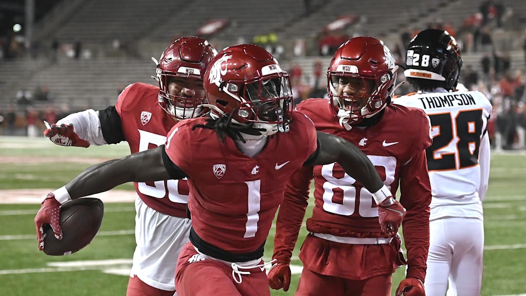 Nov 29, 2025; Pullman, Washington, USA; Washington State Cougars running back Angel Johnson (1) celebrates a a touchdown against the Oregon State Beavers in the second half at Gesa Field at Martin Stadium. Washington State Cougars won 32-8. Mandatory Credit: James Snook-Imagn Images