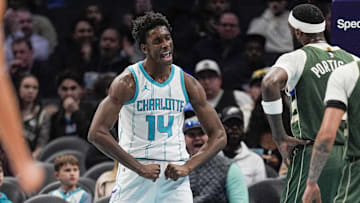 Feb 5, 2025; Charlotte, North Carolina, USA; Charlotte Hornets forward Moussa Diabate (14) reacts to his three point play against the Milwaukee Bucks during the second quarter at Spectrum Center. Mandatory Credit: Jim Dedmon-Imagn Images